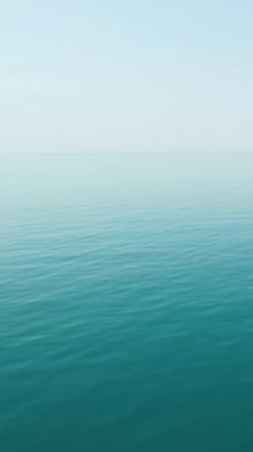 Vertical Aerial View Over Calm Azure Sea Water Surface Sun Glare Abstract Nautical Summer Ocean