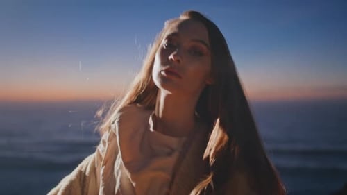 Relaxed Girl Dancing Alone in Sunset Ocean Side Closeup Woman Looking Camera