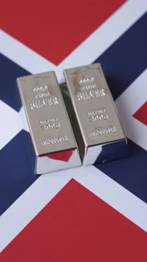 A silver bar against a backdrop of Norway flag, as a concept for the sales market. A silver bar