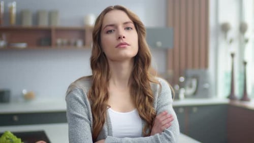 Close-Up of Woman Indoors Looking at Camera