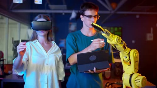 Woman Uses VR with Robotic Arm Technology
