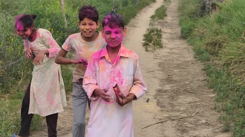 Children Playing Holi in a Village, Throwing Colors with Joy in India