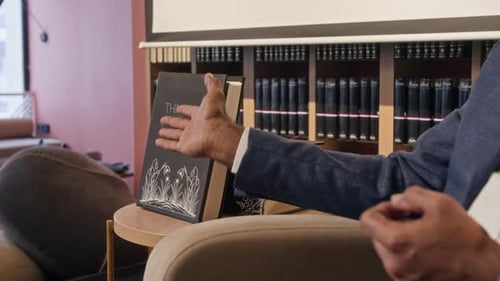 Close-up of Unrecognizable Man Talking About his Upcoming Book on stage