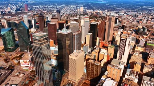 Flying closer to the group of skyscrapers in the city center. Urban panorama of Dallas, Texas, USA