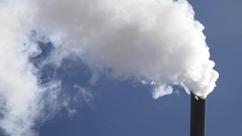 Thick white smoke pollutes the air causing the global warming effect