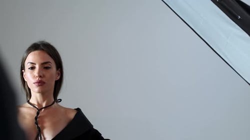 Fashionable Young Woman Posing in a Studio