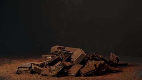 Cascading Chocolate Spins Against Black a Dance of Shadows A Powerful Image for Storytelling in