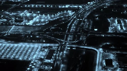 Aerial view of illuminated highway traffic road at night. cars driving freeway
