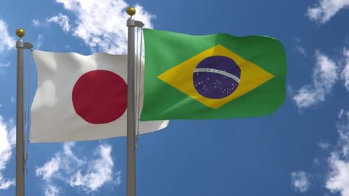 Japan and Brazil National Flags Waving on Flagpoles