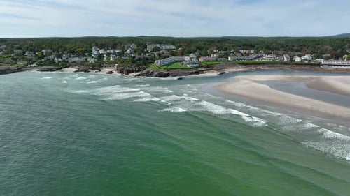 Drone View of Scenic Beach Rocky Shoreline and Coastal Village Resort