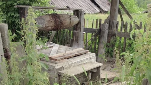 Well In The Old Village. Water Well Near The Destroyed House