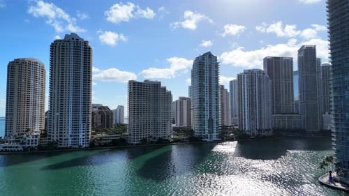 Drone Aerial View of Miami Skyscrapers with Sunlight Reflecting on the Water