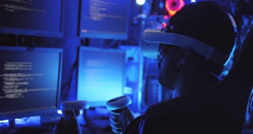 Young Adult Immersed in Futuristic Virtual Reality Game