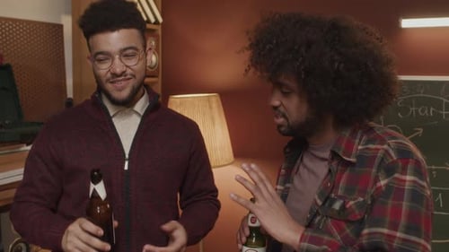 Three Friends Drinking and Talking Indoors
