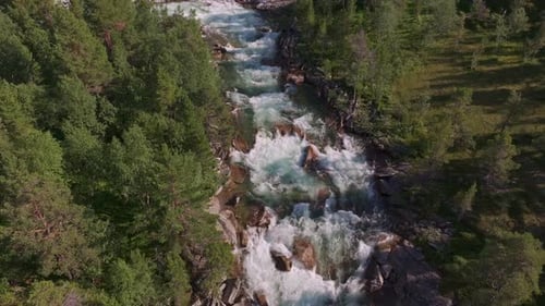 Aerial View Over The Surface Of A Mountain River Camera Move Down