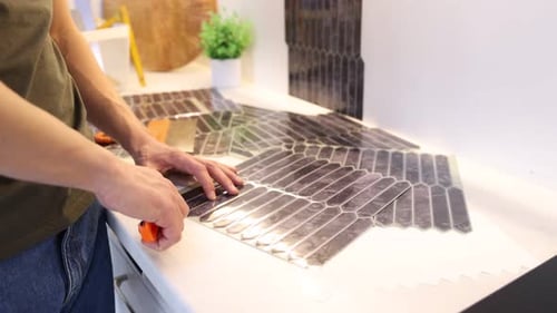Man Preparing Peel and Stick Tiles for Renovation