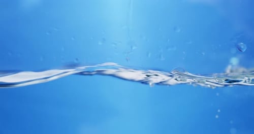 Crystal Clear Ripple Effect: Stunning View of Water Droplets Creating Smooth Waves