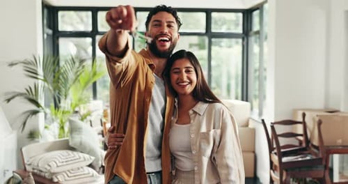Happy Couple Holding New Home Keys