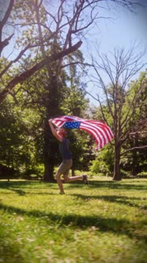 Woman Runs With American Flag in the Sunlight