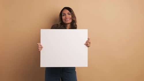 Woman Holding Blank Sign in Studio Setting