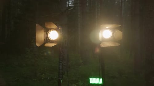 Stage Equipment Lighting Fixtures are Turned on in the Forest at Night