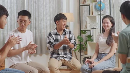 Group of Young Adults Sitting in a Circle