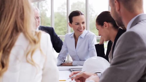 Smiling business team having a meeting at workplace