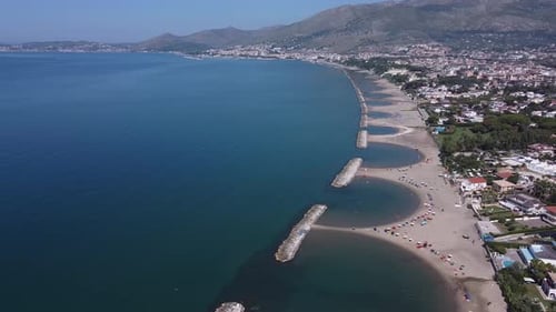 Small bays and sandy coastline of Italy, aerial drone side fly view