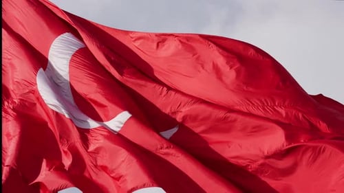 Red Flag Waving in the Wind Close Up