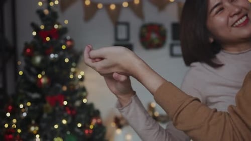 Close-up of a happy asian woman face happy with lover on Christmas