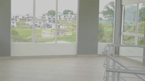 living room with large window on the second floor