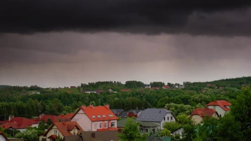 Gray clouds moving over Kolbudy village in pomeranian district.