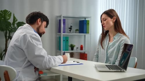 Doctor and Patient Discussing Medical Diagnosis in Office