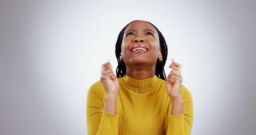 Woman Crossing Fingers for Good Luck, Close Up
