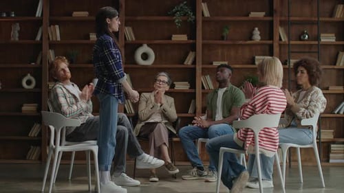 People in Group Therapy Session Clapping