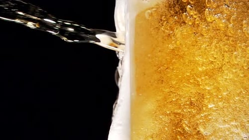 Beer Pouring in Slow Motion into a Glass