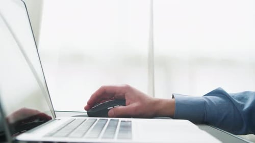 Click Computer Mouse on a Work Desk Working with a PC or Laptop