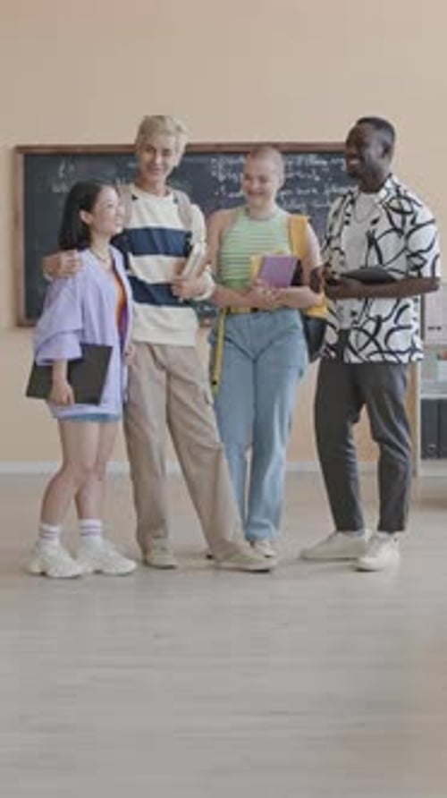 Group of Happy College Students Posing in Classroom
