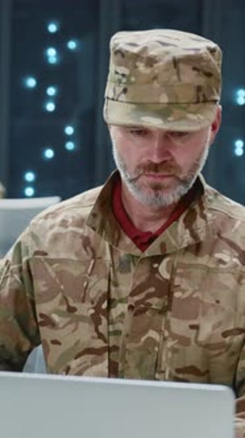 Bearded Army Officer in Camouflage Uniform Performing Secret Data Center Security Operations