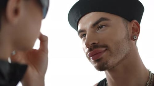 An Elegant and Stylish Makeup Application Featuring a Trendy Model in a Professional Studio