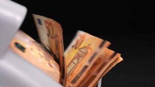 Automated Machine Counts Stack of 50 Euro Bills