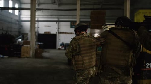 Special Forces Military Team Points Guns Trying To Find Hiding Suspects In Storage Warehouse Unde...