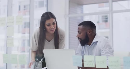 4k video footage of two businesspeople working together in an office