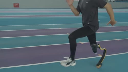 Man Runs on Track with Prosthetic Leg