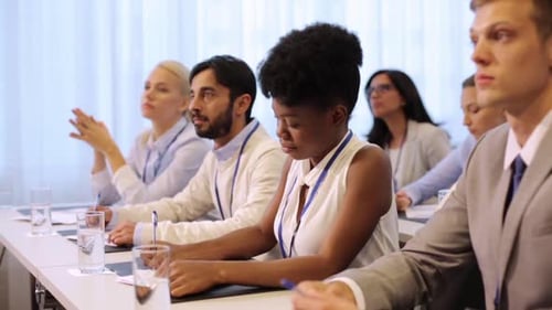 People Taking Notes in a Corporate Meeting