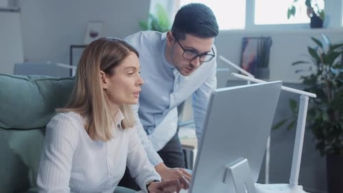 Focused Teamwork in Modern Corporate Office Environment