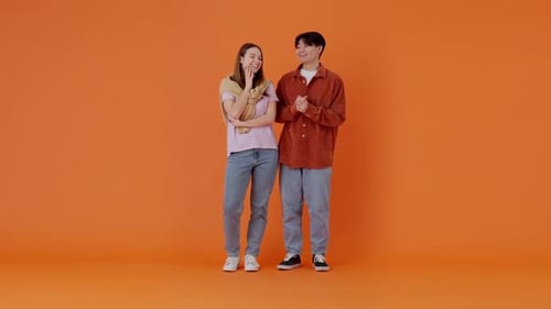 Young Couple of European Lady and Asian Guy Dreaming in Room