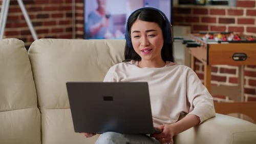 Woman on Laptop Video Call at Home