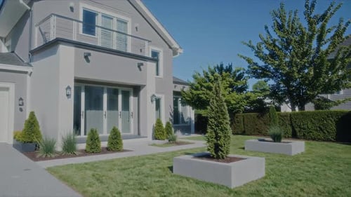 A Modern House Designed with Stylish Landscaping and a Beautifully Arranged Garden Area
