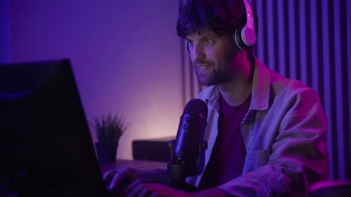 Man Streaming Online, Speaking Into Microphone